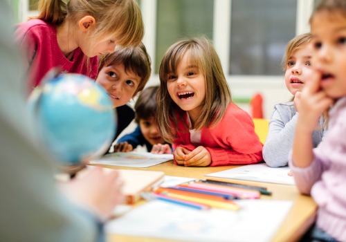 Children drawing and learning about the earth at a daycare center in Peoria IL