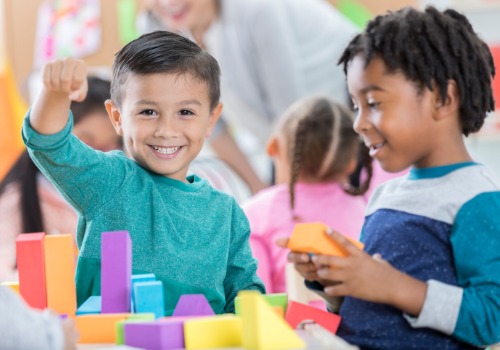 Happy children playing with blocks in Daycare for Downtown Peoria IL