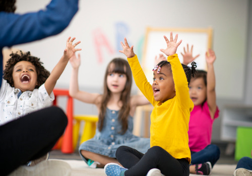 Kids laughing and playing a game in Pre-K in East Peoria IL