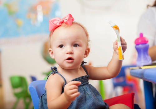 A young girl having a snack at a Child Development Center for Dunlap IL