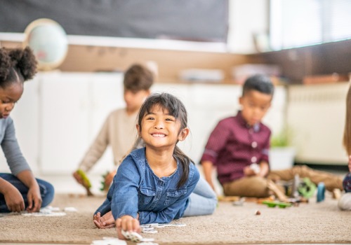 A child smiles while playing at PALS, the best day care in East Peoria IL