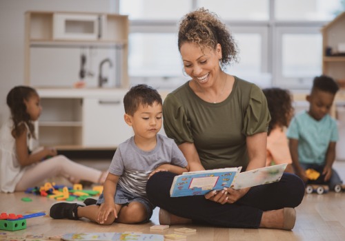 A teacher reads with her student at PALS, the best day care in East Peoria IL