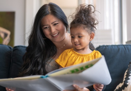 A mother reads to her child during their preschool prep time