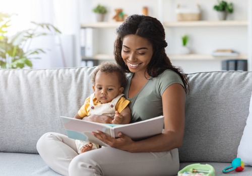 A woman reading to her baby illustrates how reading is a way to help an infant reach major milestones