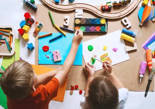 Children draw and make crafts at PALS. Our Programs & Curriculum give kids hands-on experiences that stretch their minds.