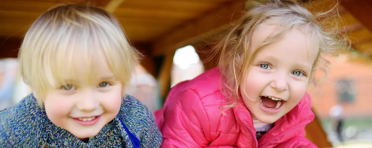 Happy kids play outside at PALS. Our Programs & Curriculum provide numerous opportunities to play and grow.